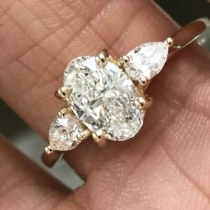 1.40 Carat TW Oval and Pear Shape 3 Stone Diamond Ring - Ben Dannie