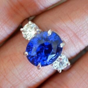 7.39 Carat Blue Sapphire 3 Stone Diamond Ring.